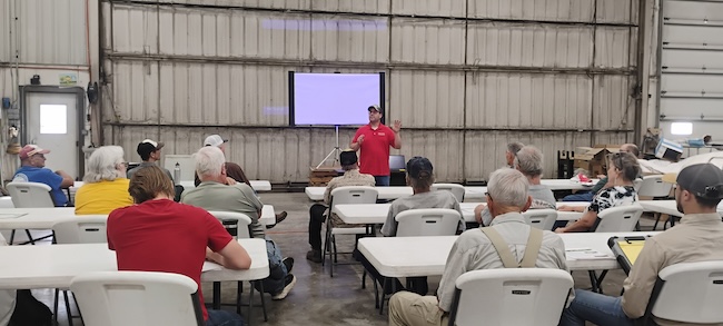 Dan Andersen leads field day class