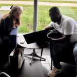 Philip working with a student