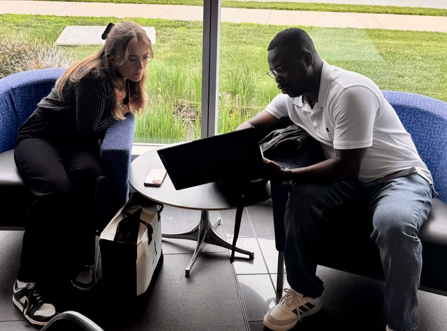Philip working with a student