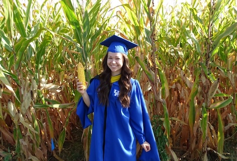 Hallie Sandeen graduation photo standing in corn